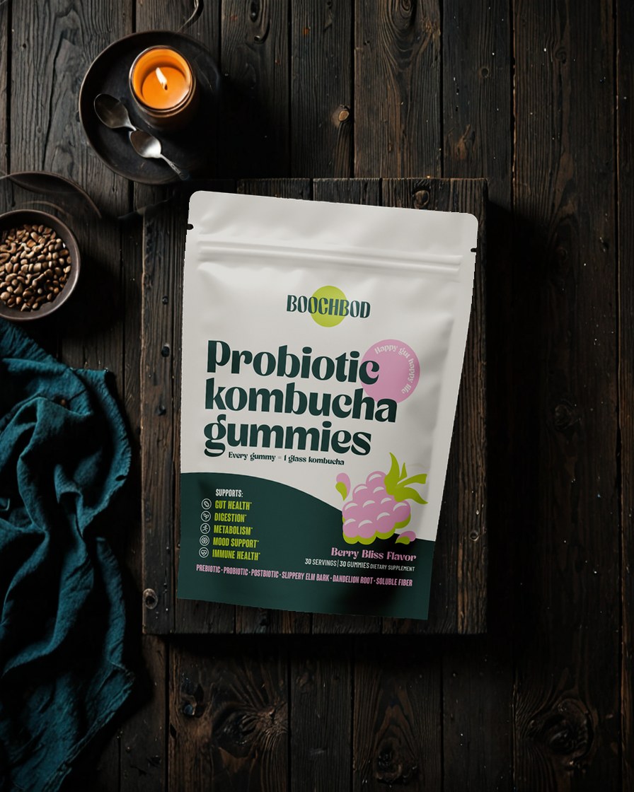A pack of BoochBod kombucha gummies on a dark wooden table